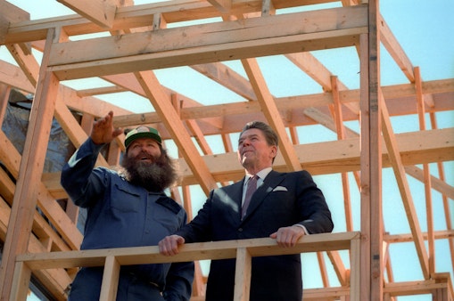 Reagan with a construction worker at a home site